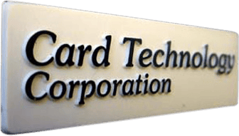 This metal nameplate features a sleek design with a cream-colored background and bold, black raised text that prominently displays the company name "Card Technology Corporation." The striking contrast between the cream plate and black lettering ensures high visibility, while the refined finish gives it a professional appearance. The combination of colors and elegant layout makes this nameplate ideal for identifying the company in office settings or on equipment.