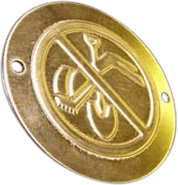 This is a circular brass nameplate featuring two mounting holes, typically positioned opposite each other for easy attachment to walls or doors. The face of the nameplate is clean and polished, with a raised design at the center depicting a cigarette overlaid by a diagonal bar—the universal "no smoking" symbol—rendered in relief for clear visibility and tactile distinction. Unlike many traditional nameplates that display company branding or names, this plaque foregoes text in favor of instantly recognizable visual communication. Its sturdy brass construction suggests durability suitable for both indoor and outdoor use in professional settings such as offices, hotels, or restaurants. The absence of company-specific engraving leaves its message universally applicable across various establishments seeking to indicate designated no-smoking areas.
