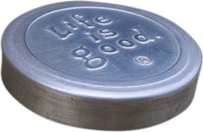 This is a round, metallic nameplate prominently displaying the optimistic phrase “Life is good.” embossed on its surface. The design is clean and minimalist, with the raised lettering catching the light against the polished metal background. Typically, such nameplates feature a company’s branding; in this case, “Life is Good” likely refers to the lifestyle brand known for spreading positive messages through their products. The plate stands out against a solid black background, emphasizing its reflective sheen and making both shape and inscription bold and easy to read.