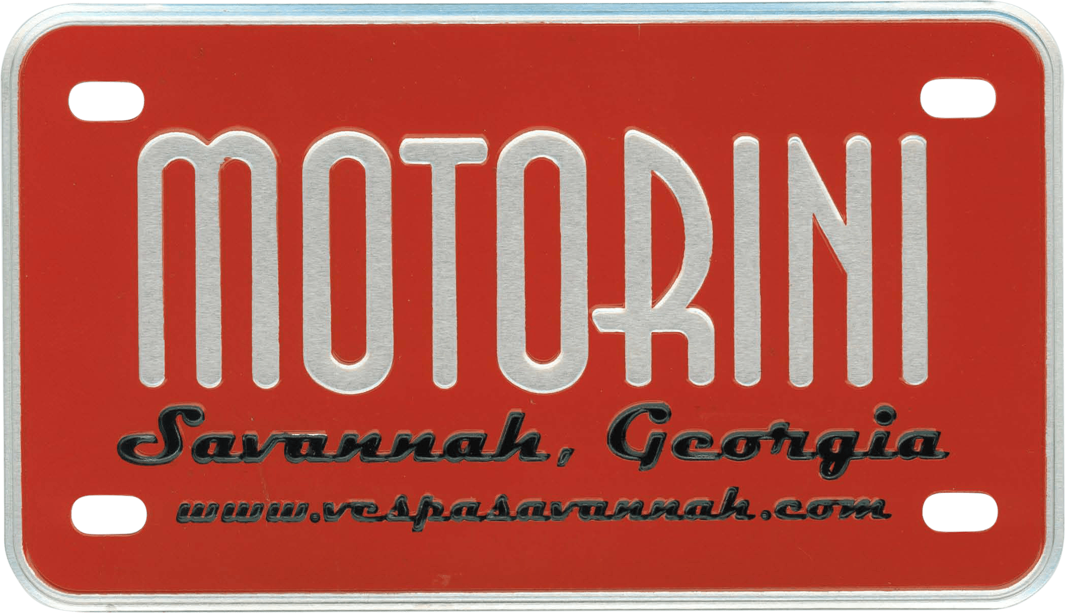 Certainly! Here’s a detailed description based on your provided information: --- This is a metal, nameplate-style license plate designed primarily in vibrant red. Dominating the center of the plate, “MOTORINI” is prominently displayed in large, bold silver lettering outlined or shadowed in black for added contrast and legibility. Below the main text, you’ll find “Savannah, Georgia” written in an elegant script along with the dealership's website address: “www.vespasaannah.com”—also rendered in a smaller, cursive font at the bottom of the plate. The overall effect combines eye-catching automotive branding with location and contact details typical of dealership nameplates. --- If you need this description adjusted for selling or cataloging purposes (such as eBay), let me know!.