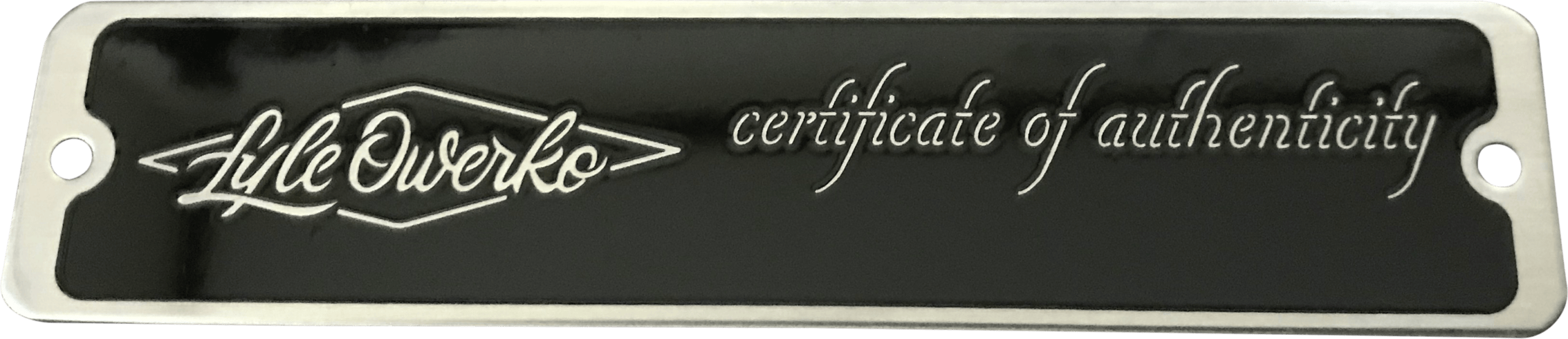 This metal nameplate features a sophisticated design, perfect for conveying authenticity and professionalism. At its center, the company name "LukeWorko" stands out in an elegant script font, immediately drawing attention. Below or alongside, the phrase "certificate of authenticity" is delicately engraved in matching script, reinforcing exclusivity and genuineness. The text itself is etched into a matte black background, creating striking contrast and ensuring legibility against the deep hue. Framing the nameplate is a sleek silver border with smooth edges that adds a modern touch, highlighting the plate's high-quality craftsmanship while making it suitable for display on luxury products or collectible items. Overall, this nameplate embodies refinement and reliability—its combination of polished metallic accents and classic script engraving makes it both visually appealing and highly representative of LukeWorko’s commitment to authenticity.